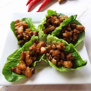 chicken san choy bow served on a plate