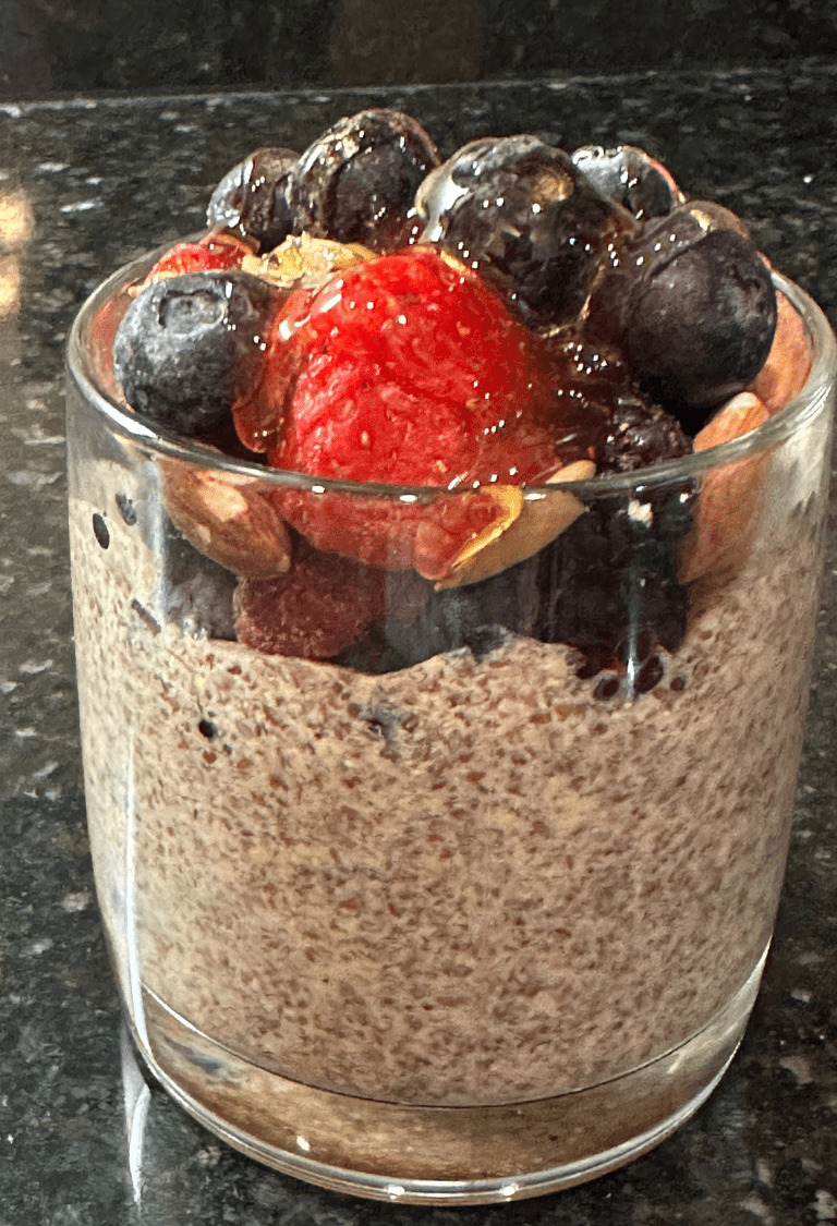 Flax seed pudding is served with frozen berries.