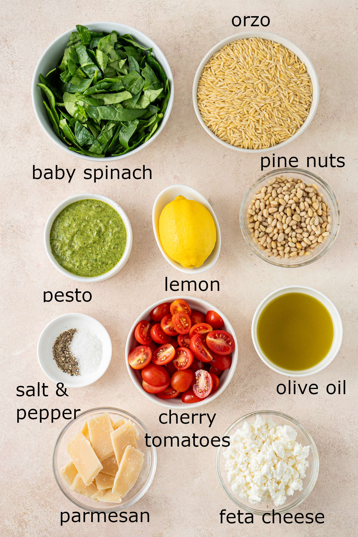 The ingredients for our salad separated into small bowls and laid out across a kitchen counter, each labelled.
