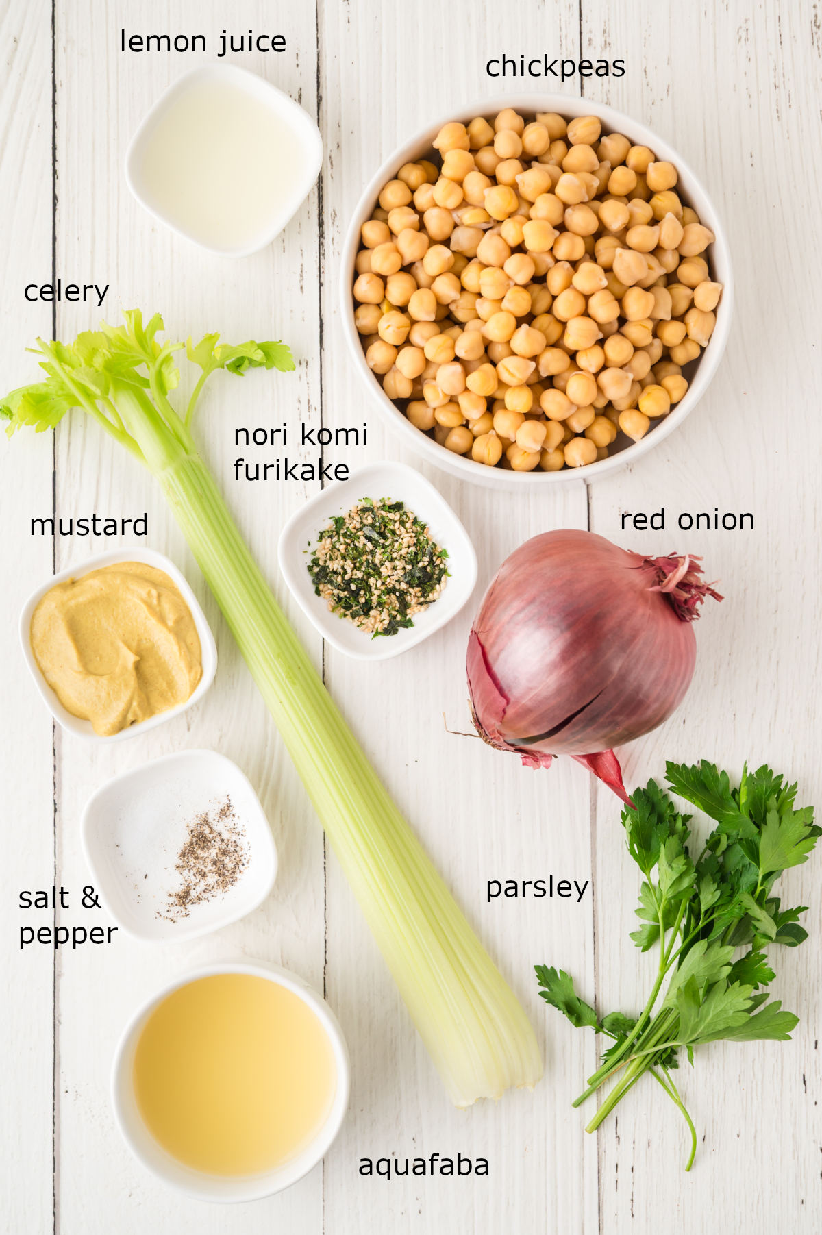 The ingredients for our salad laid out, portioned and labelled on a kitchen counter.